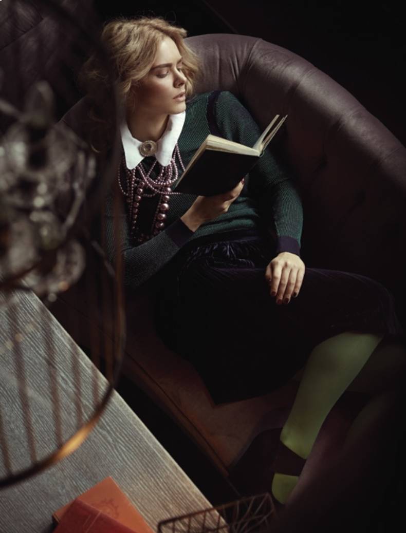 Elegant woman reading book in The Luxurious Library of Waldorf Astoria Residences Ras Al Khaimah by Al Hamra